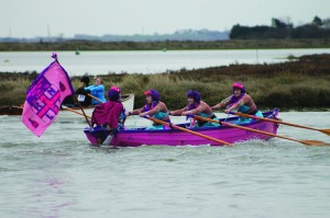 Mermaids rowing hard